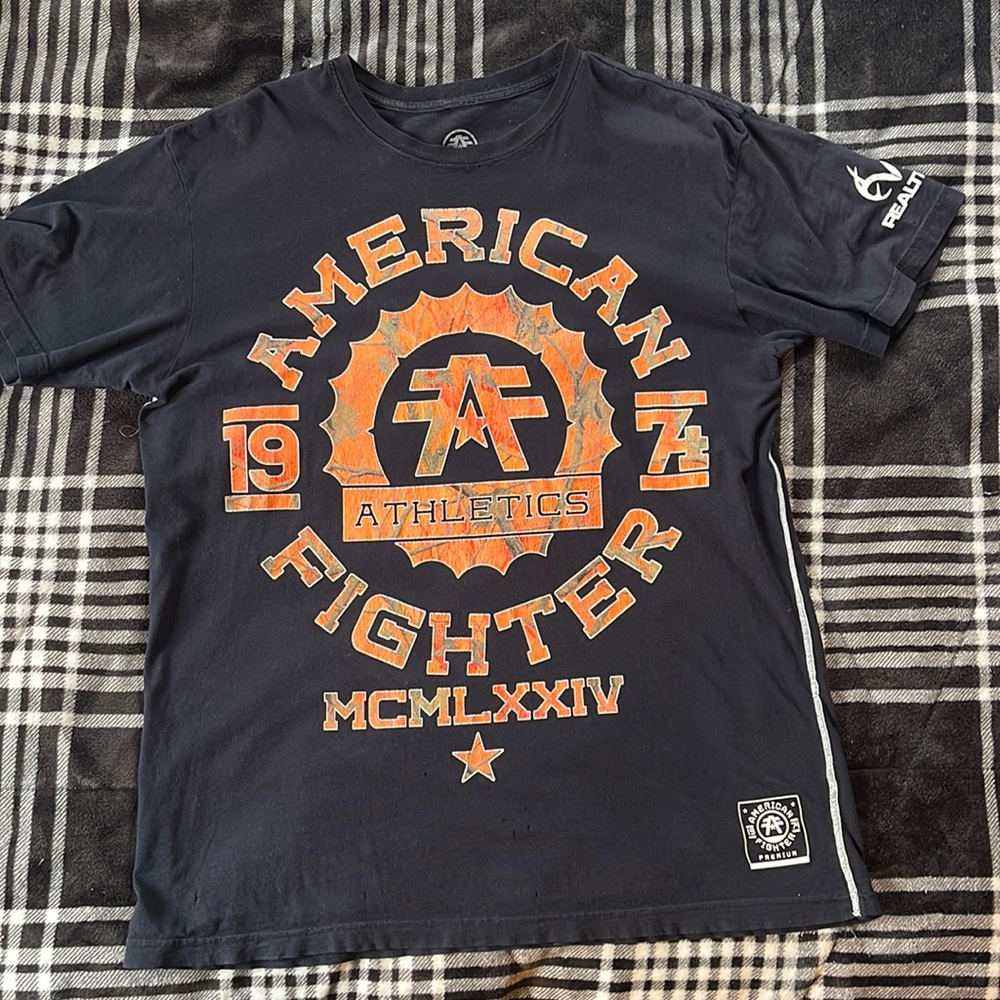 American fighter, real tree, size large safety, orange, and camo